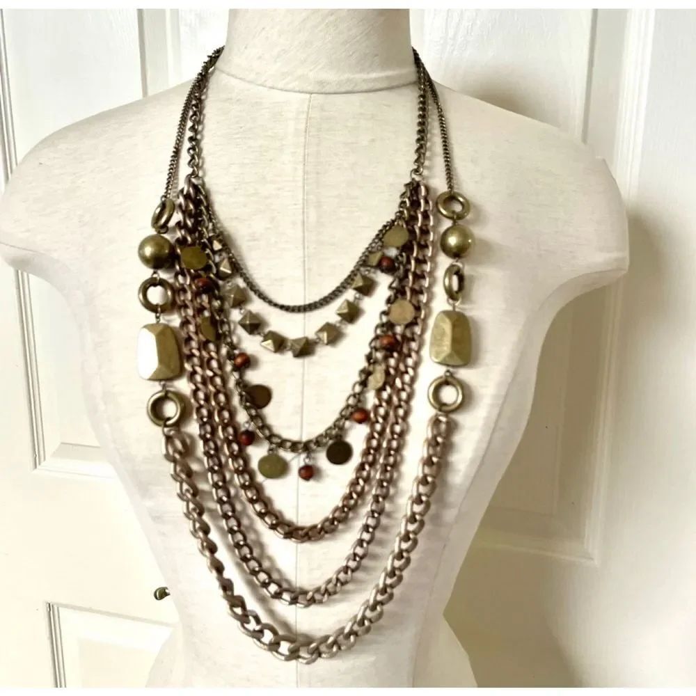 Long multi chain copper tone statement necklace